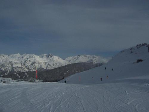 a group of people skiing down a snow covered mountain at Tschengla Ferienwohnung in Bürserberg