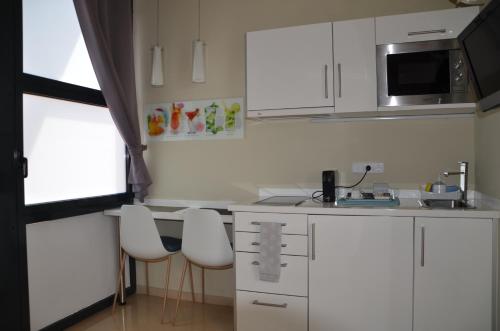 Kuchyň nebo kuchyňský kout v ubytování Apartamento playa Costa Barcelona