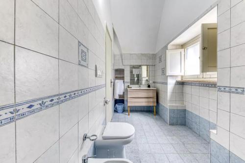 a bathroom with a toilet and a sink at Villa Cesarea Dimora di Charme in Santa Cesarea Terme