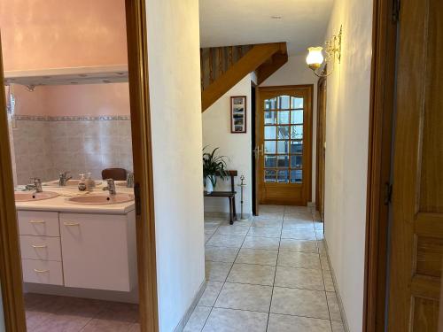 a bathroom with a sink and a mirror at la vallee in Plogoff