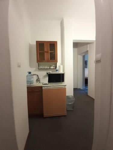 a kitchen with a sink and a stove top oven at Animrumru in Warsaw