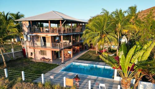 an aerial view of a house with a swimming pool at Nosy Bay View in Nosy Be