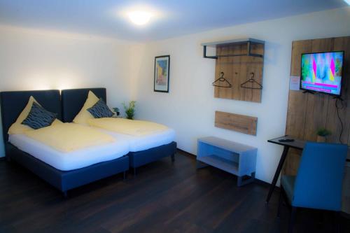 Un pat sau paturi într-o cameră la Breer S Hotel