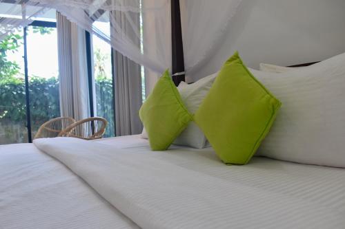 Postel nebo postele na pokoji v ubytování Golden Ray villa