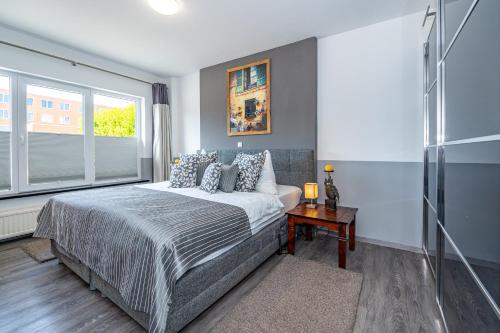 a bedroom with a large bed and a window at Mona in Westerland (Sylt)