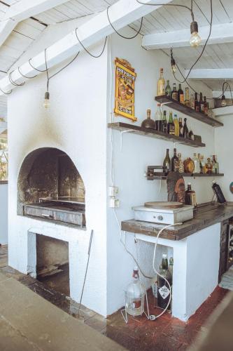 a kitchen with a pizza oven in a room at Villa Sunshine in Sremska Kamenica