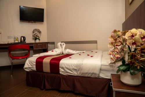 Postel nebo postele na pokoji v ubytování Hotel Eastana Ipoh