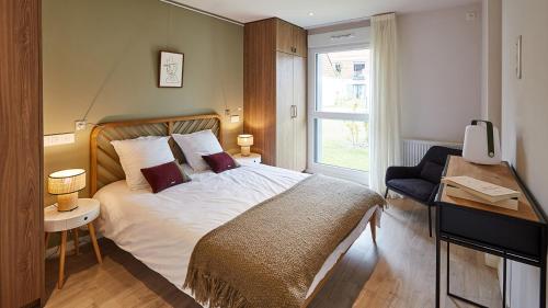 Ένα ή περισσότερα κρεβάτια σε δωμάτιο στο Domaine des diamants blancs de Bondues