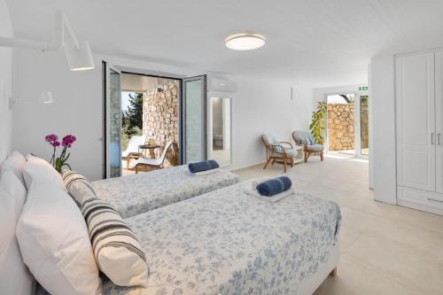 Ένα ή περισσότερα κρεβάτια σε δωμάτιο στο Eleftheria by Vintage Travel