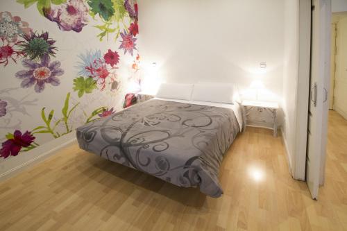 Кровать или кровати в номере Foster Apartamentos Sol