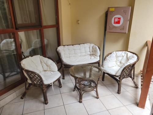 a group of chairs and a table in a room at Penzión Korzo in Štúrovo