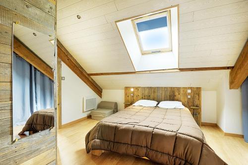 two images of a bedroom with a bed and a window at Le Ptit Bonheur - avec vue montagne et terrasse in La Bresse