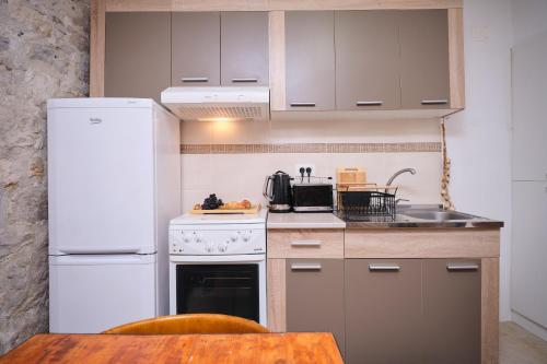 Η κουζίνα ή μικρή κουζίνα στο Apartment Galeriana Palace by Litto