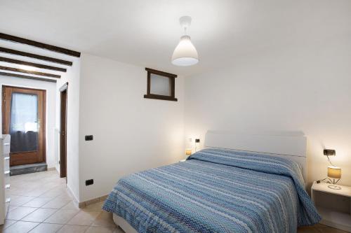 Ένα ή περισσότερα κρεβάτια σε δωμάτιο στο Casa Sabrina - Appartamento Blu