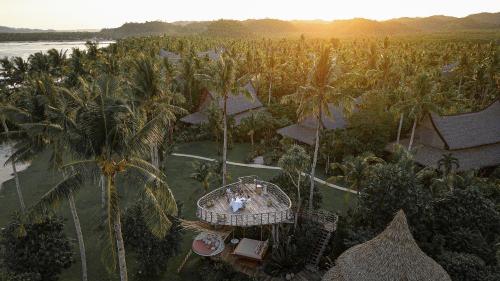 an aerial view of a resort with palm trees at Nay Palad Hideaway - All Inclusive Stay in General Luna
