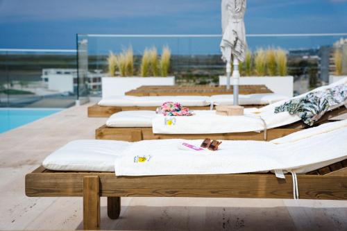 a row of beds sitting on top of a roof at Design-Apartment Olhão by Sisters of Paradise in Olhão