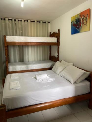 Katil atau katil-katil dalam bilik di Flatmarazul Lindos Apartamentos Privativo com cozinha