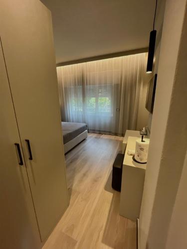 a small room with a bed and a desk at The Upper House in Riomaggiore