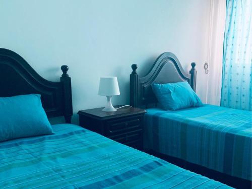 Postel nebo postele na pokoji v ubytování Refugio Terrace House Peniche
