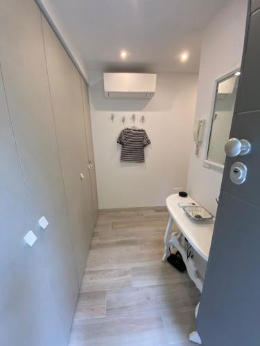 a small bathroom with a sink and a mirror at La Chicca Maison in Vercurago