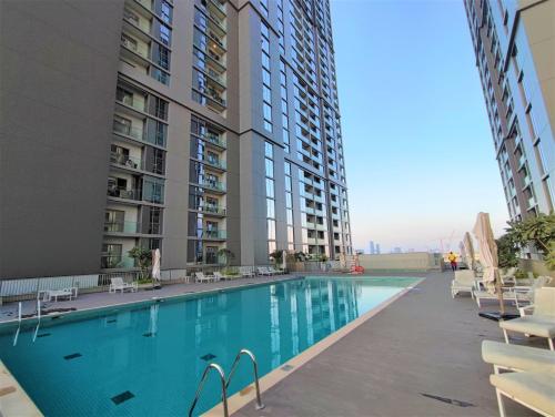 a swimming pool in the middle of a building at Sleek and Stylish 2-Bedroom Apartment in Dubai