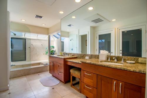 a large bathroom with two sinks and a tub at Kapalua Villas Maui - Select Your Unit in Kahana