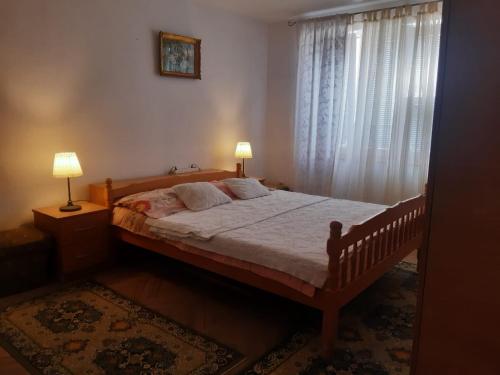 Ένα ή περισσότερα κρεβάτια σε δωμάτιο στο Apartman LEON