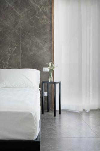 Postel nebo postele na pokoji v ubytování Hotel Mhami