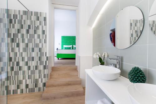 a bathroom with a sink and a mirror at Iolanda flats in Piano di Sorrento