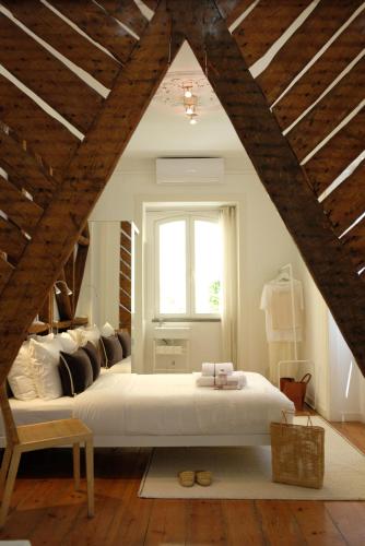 a bedroom with a large bed and a window at Lisbon City Villa in Lisbon
