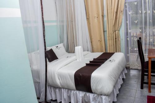 Postel nebo postele na pokoji v ubytování GLAMOUR APOLLO HOTEL