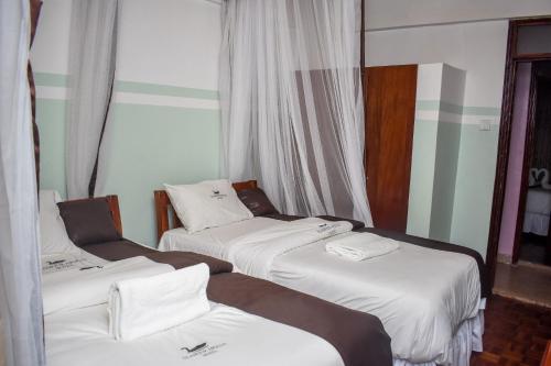 Postel nebo postele na pokoji v ubytování GLAMOUR APOLLO HOTEL