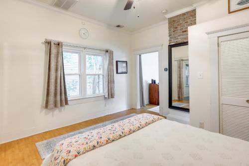 a bedroom with a bed and a window at Quaint Home with Yard about 4 Mi to Downtown Louisville! in Louisville