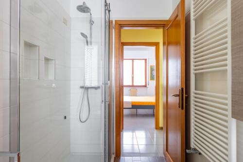 a bathroom with a walk in shower and a walk in shower at Casa Grazia in Oristano