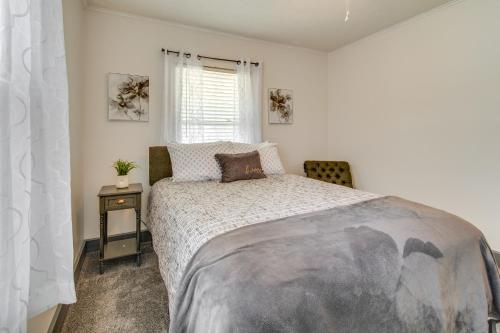 a bedroom with a large bed and a window at Charming Springfield Home 2 Mi to Downtown in Springfield