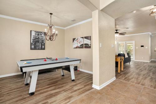 a dining room with a ping pong table in it at Long Stay Only Cibolo Getaway Pool Air Hockey in Cibolo