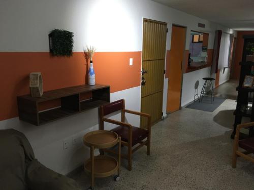 a room with a desk and a chair and a door at Private room with air conditioning in Downtown Office Parking in León
