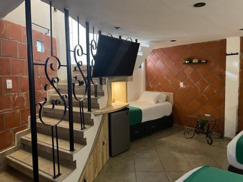 Cama o camas de una habitación en Hotel RioMiel Tlaxcala