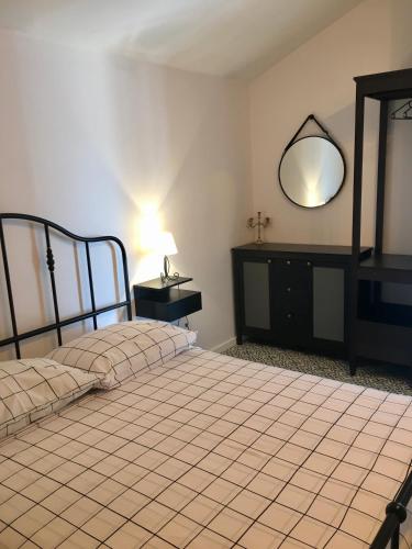a bedroom with two beds and a mirror on the wall at Land and Sea in Primošten