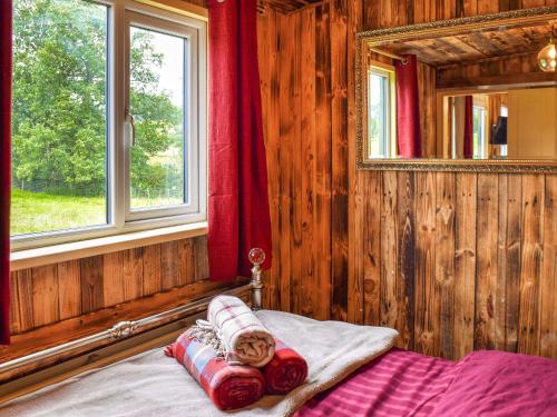 a bed in a room with a mirror and a window at Beverleys Hideaway - Uk44691 in Scorton