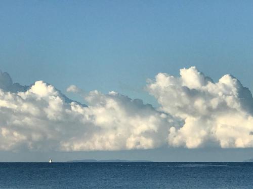 a large group of clouds over the ocean at Guesthouse - Hotel California in Novalja