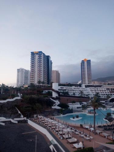 a view of a resort with a pool and buildings at Apartamento Vistas Paraiso - Club Paraiso in Adeje