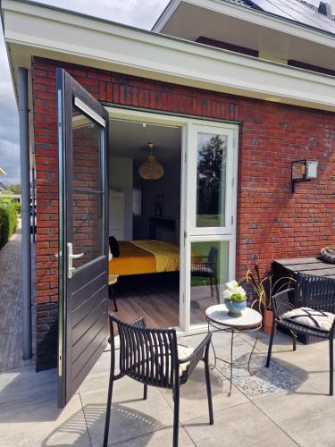 a patio with a door leading to a bedroom at Studio Flevo Batavia in Lelystad