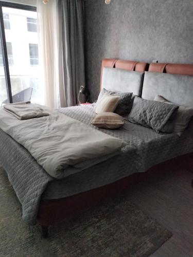 מיטה או מיטות בחדר ב-The Lofthouse