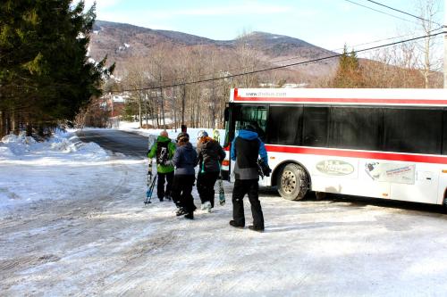 a group of people standing outside of a bus at Perfect four bedroom condo with shuttle to the mountain, ski Back Whiffletree D8 in Killington