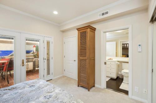 a bedroom with a bed and a bathroom at 416 Dahlia in Newport Beach