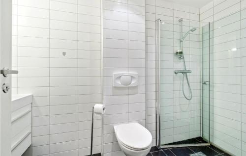 a bathroom with a toilet and a glass shower at Lovely Apartment In Geilo With Wifi in Geilo