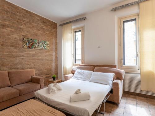 a bedroom with a bed and a couch at [Stazione SMN]Art House Florence in Florence