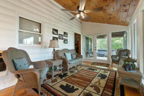 a living room with chairs and a ceiling fan at Mountain Rivers Lodge in Blue Ridge
