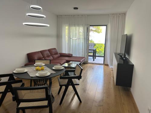 a living room with a couch and a table at Apartment Marta in Orebić